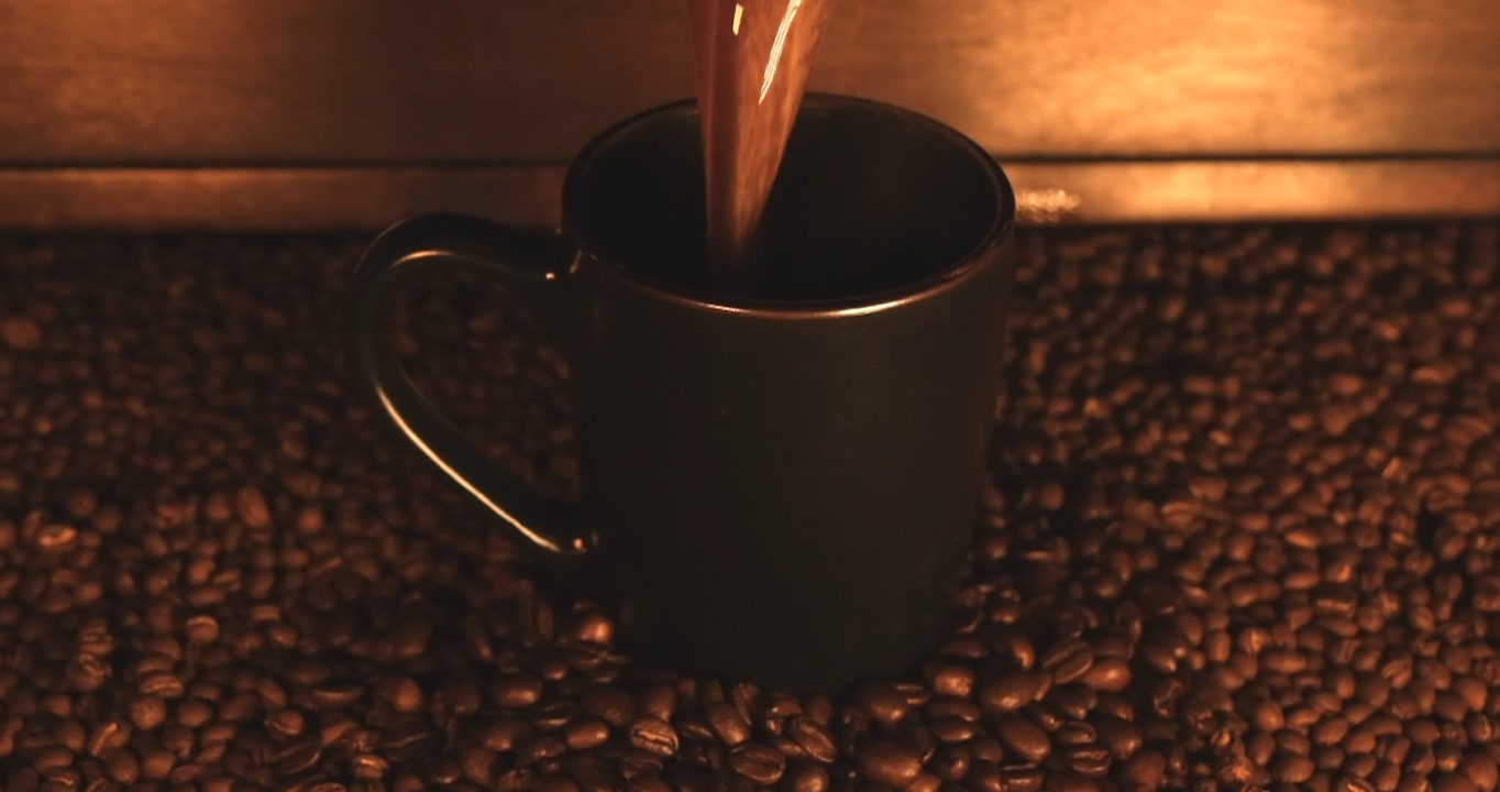 Coffee being poured into a mug